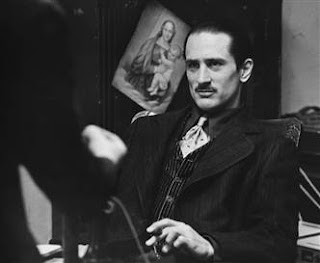 Note that God is portrayed as a baby. To make the Godfather Trilogy brief, the family is destroyed from within by the curse of Vatican II