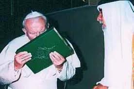 John Paul II kisses a koran