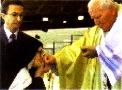 The imposter Sister Lucy oddly kisses the hand of Antipope John Paul II after receiving 'communion'