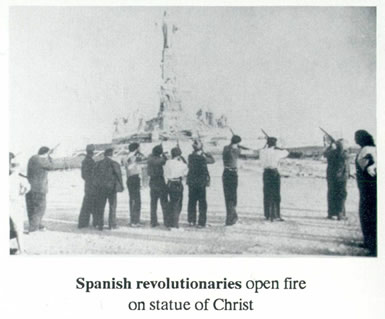 Spanish revolutionaries open fire on a statue of Christ