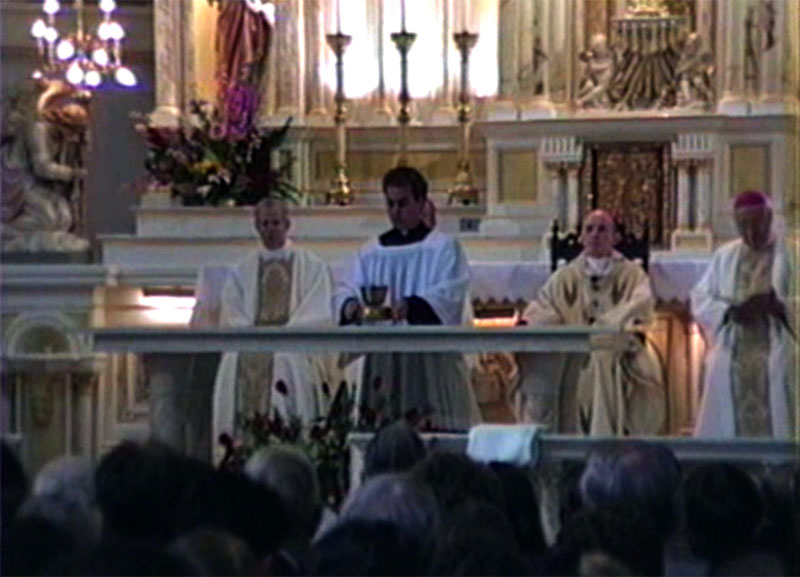 Masonic Cardinal Bernardin performs the Opus Dei Novus Ordo Mass to Satan with his back turned to God, sitting in a throne as if he was God.